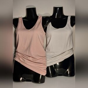 White and pink shapewear tank tops.